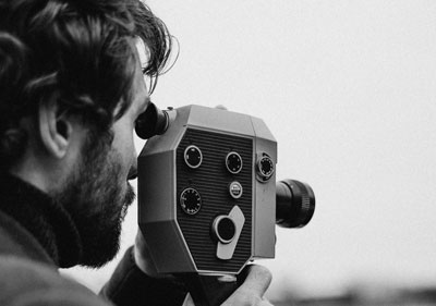 a filmmaker with a camera